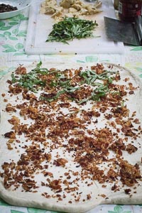 Sprinkle pancetta and basil