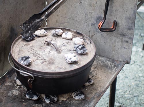 Placing Hot Coals to Bake at 350