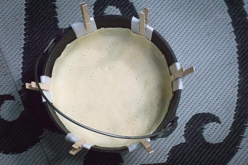 Pie dough with fork holes in prepared 10-inch Camp Dutch Oven